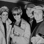 Edie Sedgwick, Andy, Chuck Wein and Gerard Malanga board a plane to Paris, NYC, May 1965
