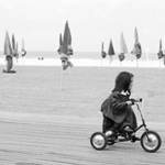 Girl on tricycle, Deauville, France